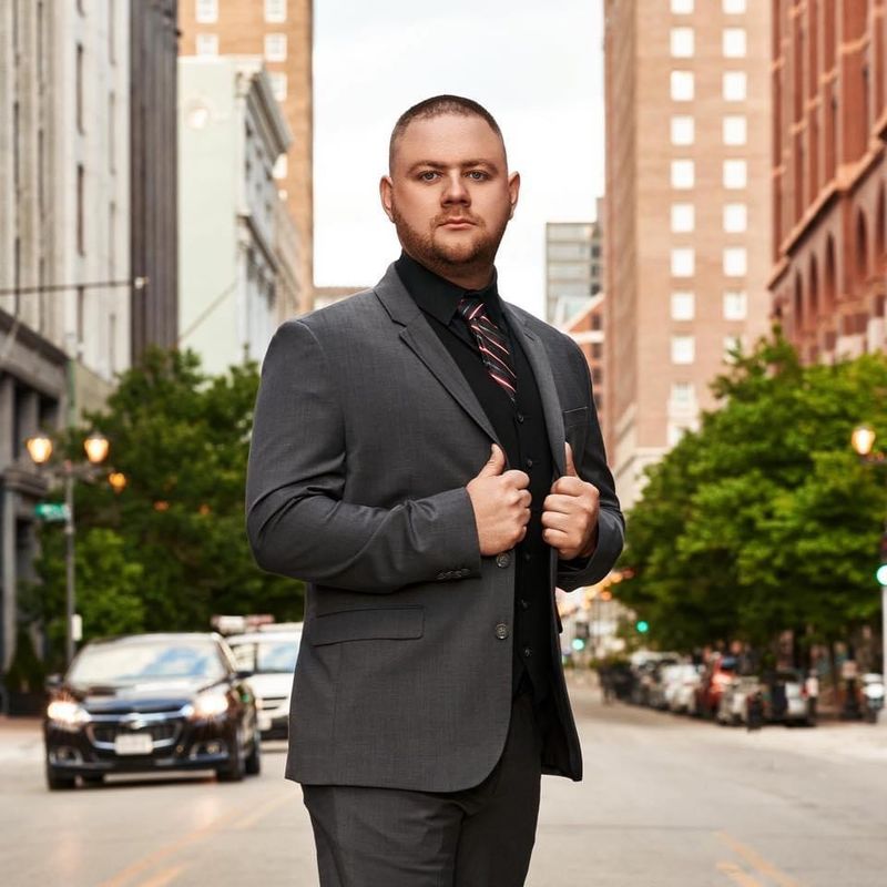 Steven Vanderbilt in a charcoal suit on a city street